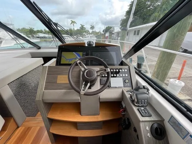 Nexlevel Yacht Photos Pics 2019 Tiara Yachts C53 Coupe helm station with modern navigation equipment.