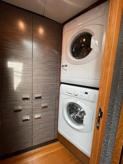 Nexlevel Yacht Photos Pics Stacked washer and dryer in 2019 Tiara Yachts C53 Coupe laundry area.