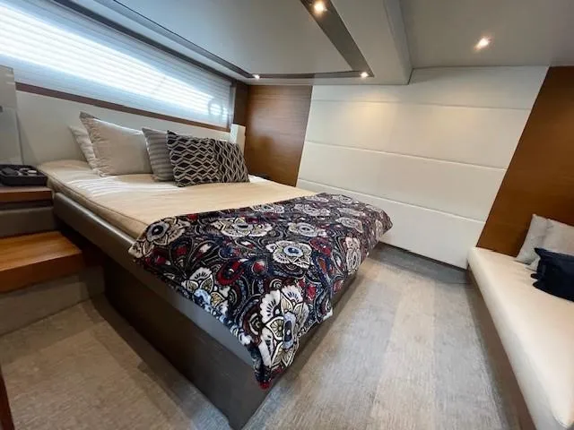 Nexlevel Yacht Photos Pics Luxurious bedroom interior of 2019 Tiara Yachts C53 Coupe with modern decor.