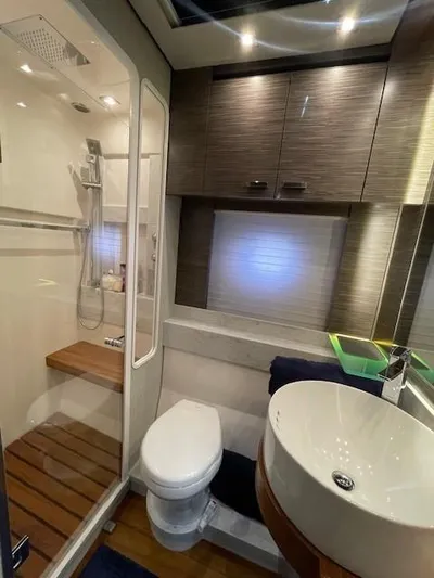 Nexlevel Yacht Photos Pics 2019 Tiara Yachts C53 Coupe bathroom with modern fixtures and shower.