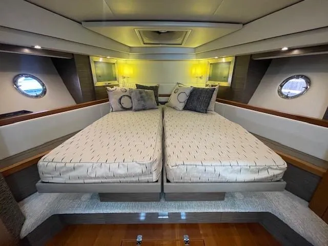 Nexlevel Yacht Photos Pics 2019 Tiara Yachts C53 Coupe bedroom with twin beds and modern decor.