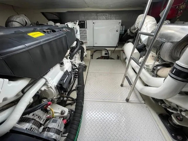 Nexlevel Yacht Photos Pics Engine room of a 2019 Tiara Yachts C53 Coupe with visible machinery and equipment.