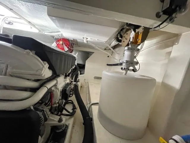 Nexlevel Yacht Photos Pics Engine room of a 2019 Tiara Yachts C53 Coupe with visible components.