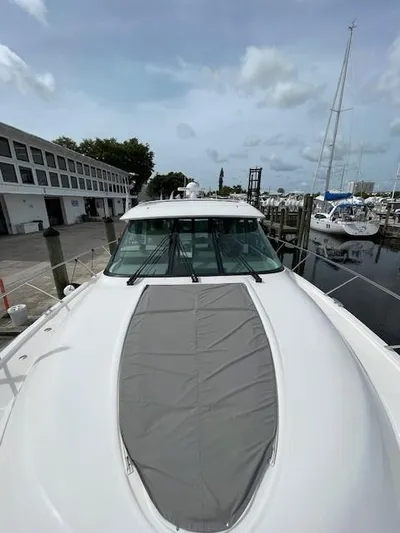 Nexlevel Yacht Photos Pics 2019 Tiara Yachts C53 Coupe docked at a marina, front deck view.