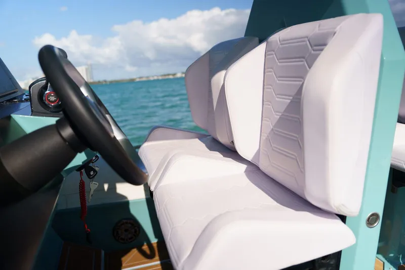  Yacht Photos Pics Novielli Veloche 349 boat interior, 2025 model, featuring modern white seating and steering wheel.