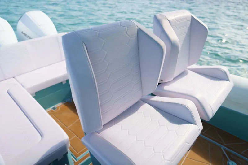  Yacht Photos Pics Luxury seating on 2025 Novielli Veloche 349 boat, featuring white upholstery and ocean backdrop.