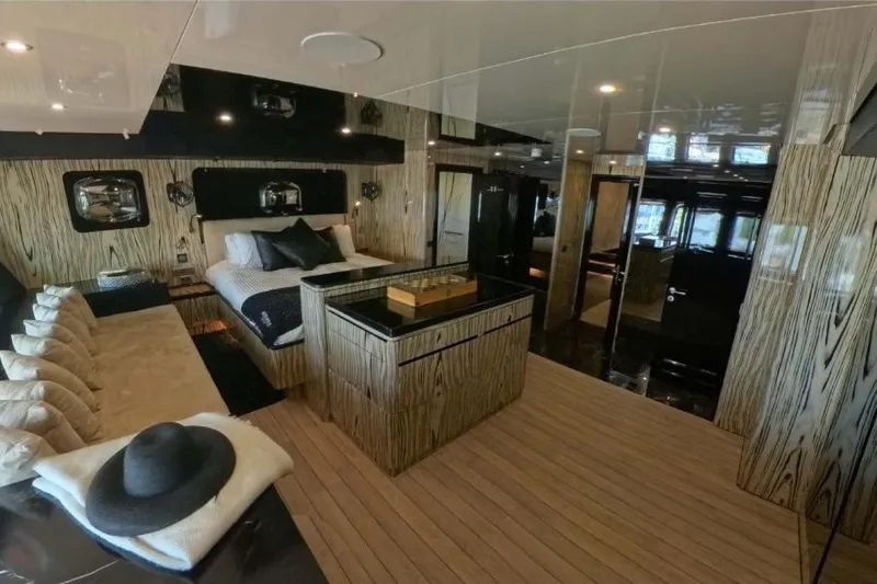 Odisea Yacht Photos Pics Luxurious interior of 2006 Custom Mahogany Expedition Gulet with elegant wood finishes and modern decor.