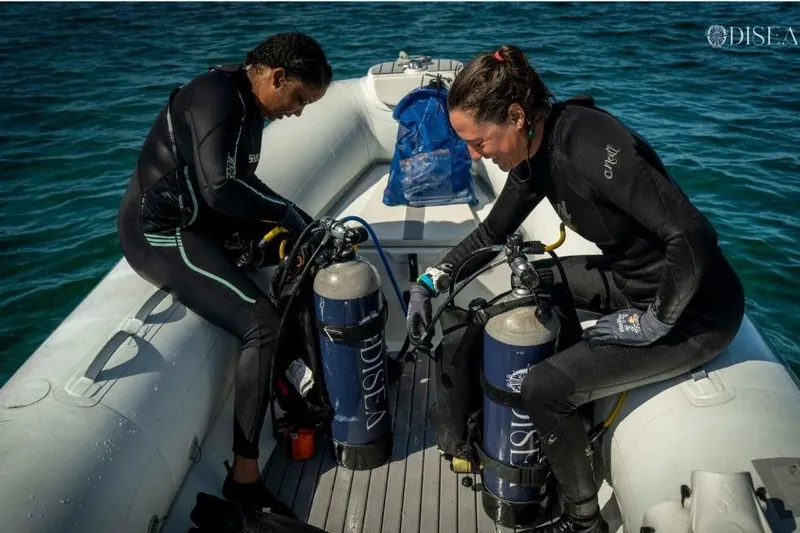 Odisea Yacht Photos Pics Two divers prepare scuba gear on a Custom Mahogany Gulet, Expedition Gulet, 2006.
