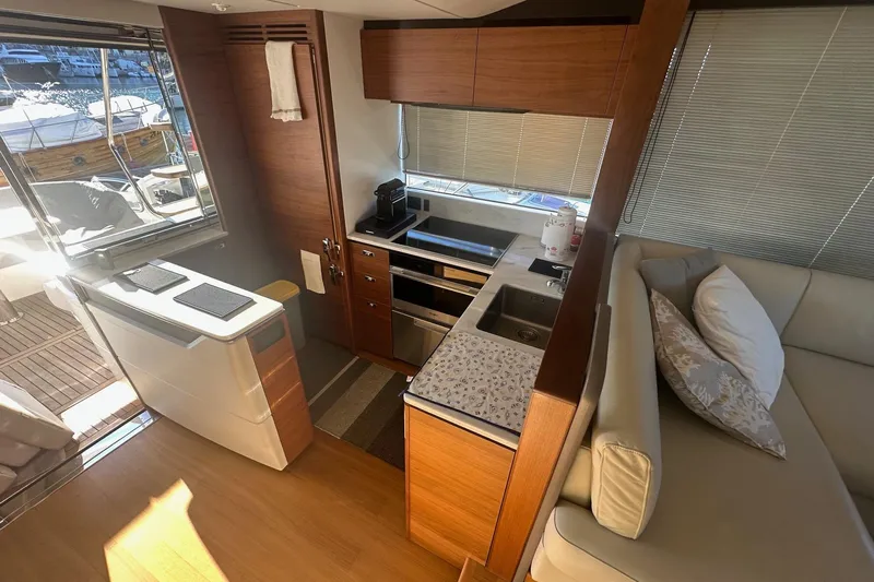  Yacht Photos Pics Luxurious 2020 Princess S62 yacht interior with modern kitchen and cozy seating area.