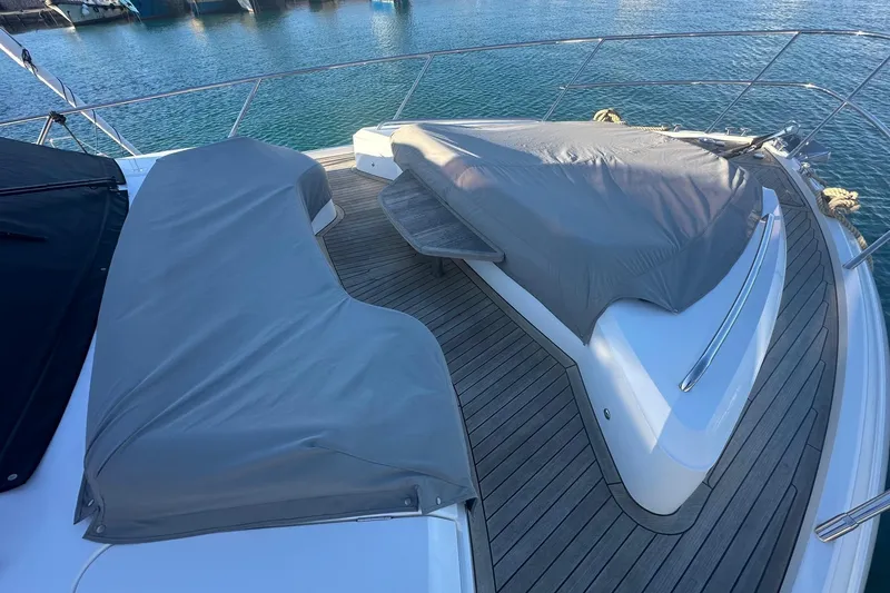  Yacht Photos Pics Luxury Princess S62 yacht deck with covered seating, 2020 model, docked at marina.