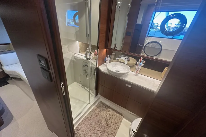  Yacht Photos Pics Luxurious bathroom in 2020 Princess S62 yacht with modern fixtures and elegant design.