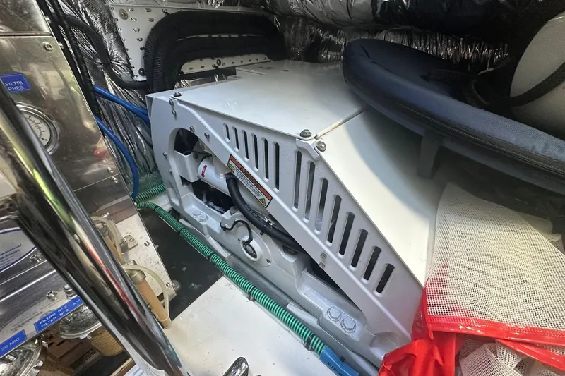  Yacht Photos Pics Engine room of a 2020 Princess S62 yacht, showcasing mechanical components and wiring.