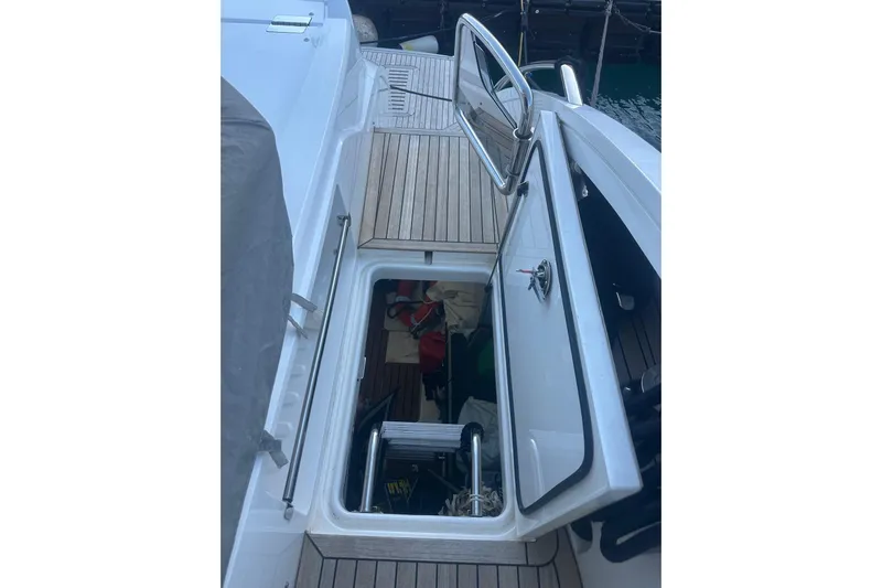  Yacht Photos Pics 2020 Princess S62 yacht with open hatch and visible interior storage.