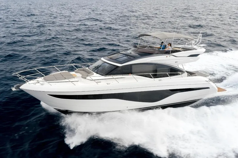  Yacht Photos Pics 2020 Princess S62 yacht cruising on open sea, showcasing sleek design and luxury features.