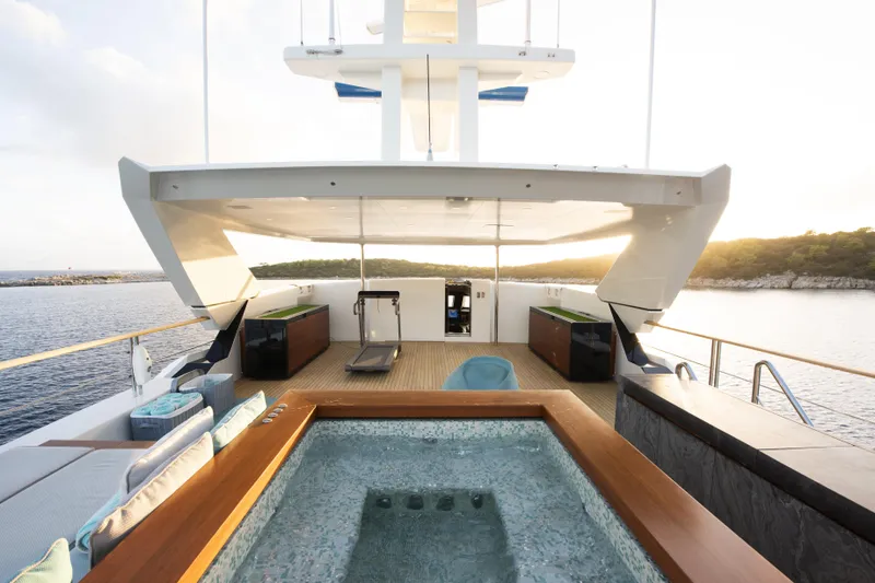 Serenity Yacht Photos Pics Luxurious Mondomarine SF40 yacht deck with jacuzzi and scenic ocean view, 2015 model.