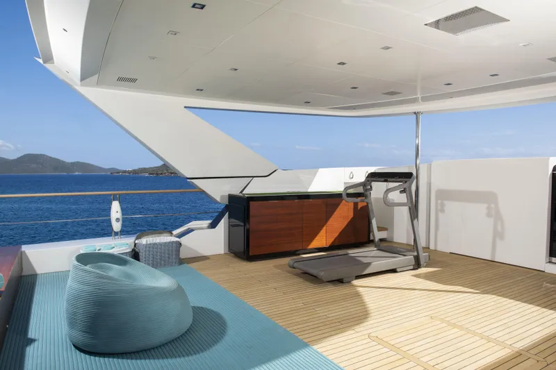 Serenity Yacht Photos Pics Luxurious Mondomarine SF40 yacht deck with treadmill, seating, and ocean view, 2015 model.