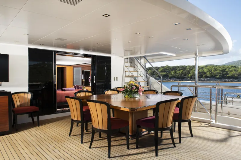 Serenity Yacht Photos Pics Luxurious Mondomarine SF40 yacht deck with elegant dining area, 2015 model.
