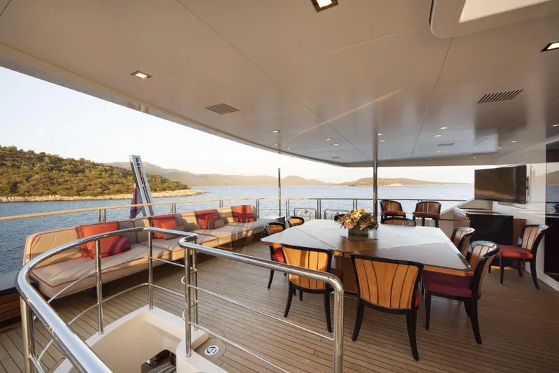 Serenity Yacht Photos Pics Luxurious 2015 Mondomarine SF40 yacht deck with elegant seating and scenic ocean view.