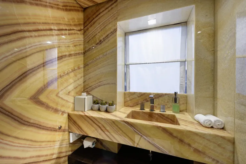 Serenity Yacht Photos Pics Luxurious Mondomarine SF40 2015 yacht bathroom with elegant marble sink and modern fixtures.