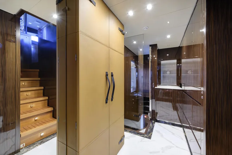 Serenity Yacht Photos Pics Luxurious interior of 2015 Mondomarine SF40 yacht with wooden stairs and modern design.