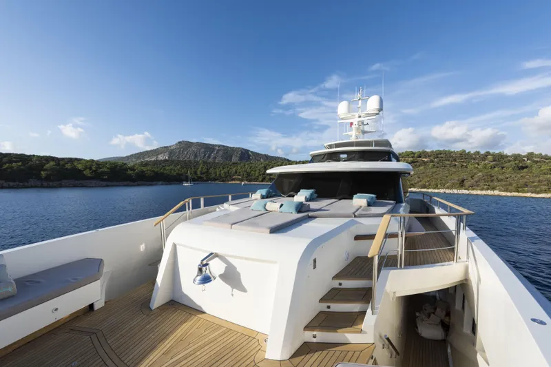 Serenity Yacht Photos Pics Luxurious 2015 Mondomarine SF40 yacht with sun deck, cruising in scenic coastal waters.