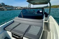 2022 Quarken 27 T-Top boat with sleek design on calm water.