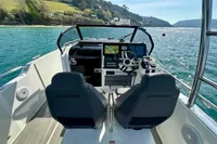 2022 Quarken 27 T-Top boat interior with dual seats and scenic water view.