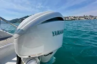 Yamaha outboard motor on Quarken 27 T-Top boat, 2022 model, in scenic waters.