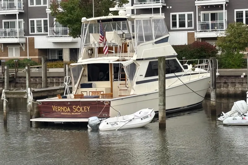  Yacht Photos Pics 1986 Viking 48 Convertible yacht docked, named "Vernda Sóley," in Saugatuck, Michigan marina.