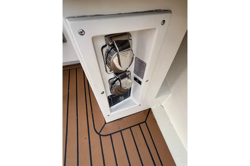  Yacht Photos Pics Power outlet panel on 1986 Viking 48 Convertible boat with teak flooring.