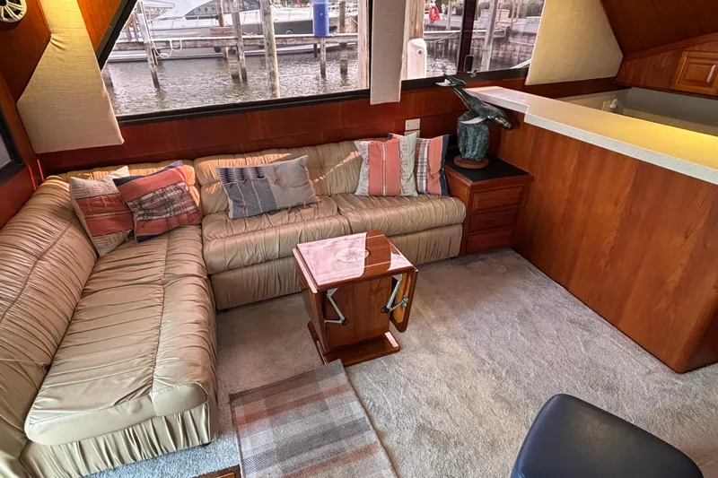  Yacht Photos Pics Interior of 1986 Viking 48 Convertible yacht with cozy seating and nautical decor.