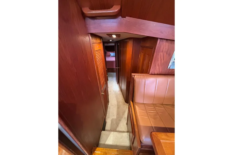  Yacht Photos Pics Interior of 1986 Viking 48 Convertible yacht with wood paneling and seating.