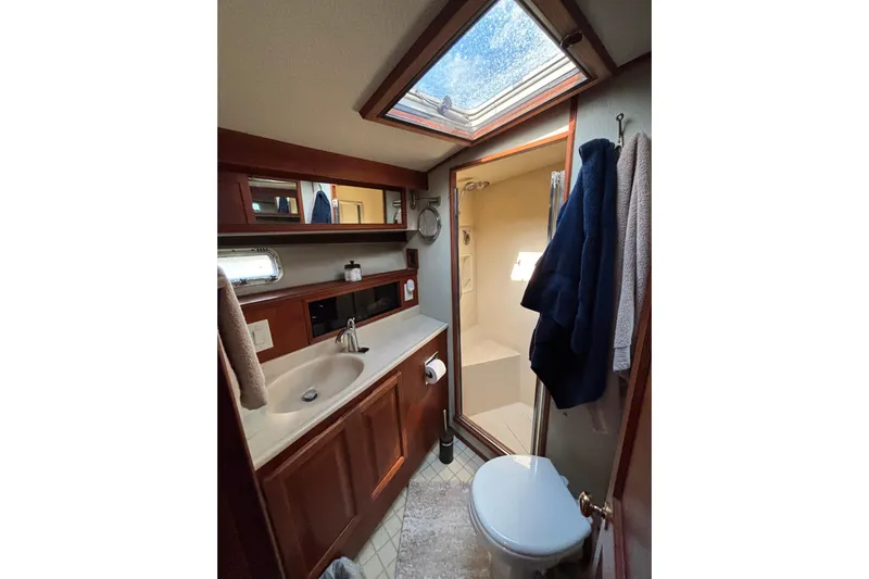  Yacht Photos Pics Bathroom interior of 1986 Viking 48 Convertible yacht with skylight and shower.