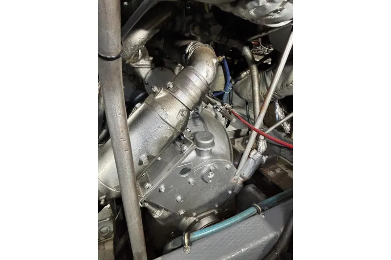  Yacht Photos Pics Engine compartment of a 1986 Viking 48 Convertible boat, showcasing mechanical components.