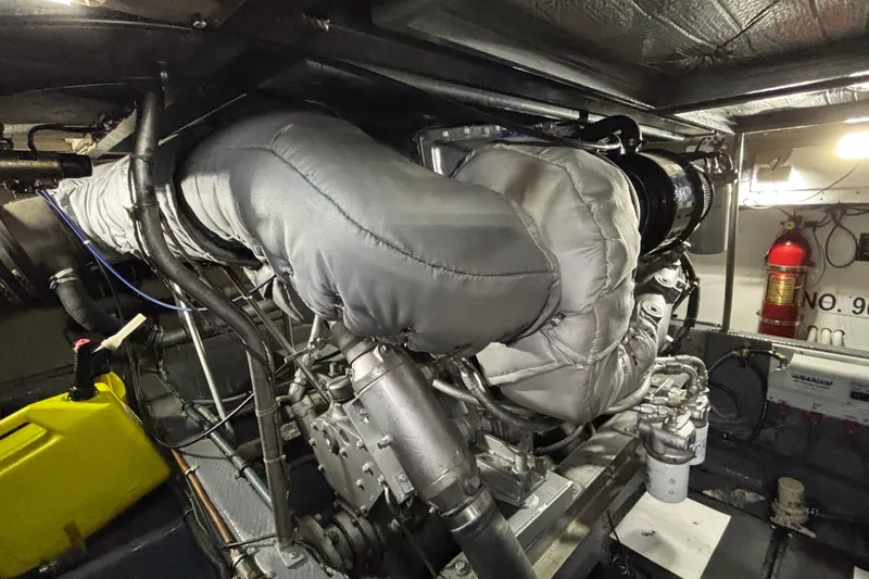  Yacht Photos Pics Engine room of 1986 Viking 48 Convertible yacht with insulated components and fire extinguisher.