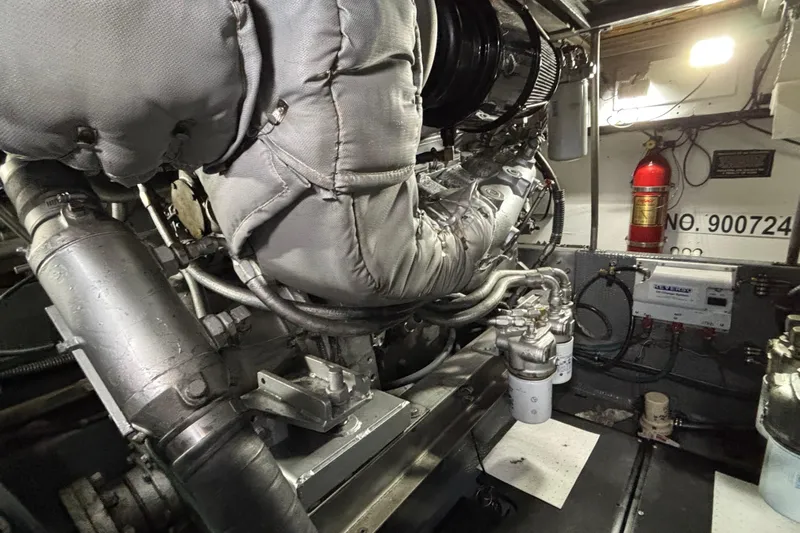  Yacht Photos Pics Engine room of a 1986 Viking 48 Convertible yacht, featuring machinery and fire extinguisher.