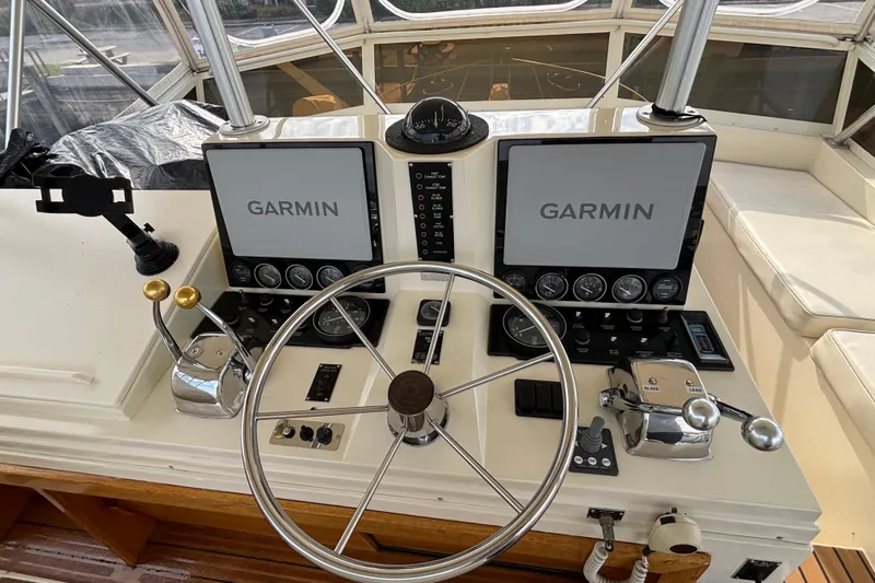  Yacht Photos Pics Control panel of a 1986 Viking 48 Convertible boat with Garmin navigation displays.