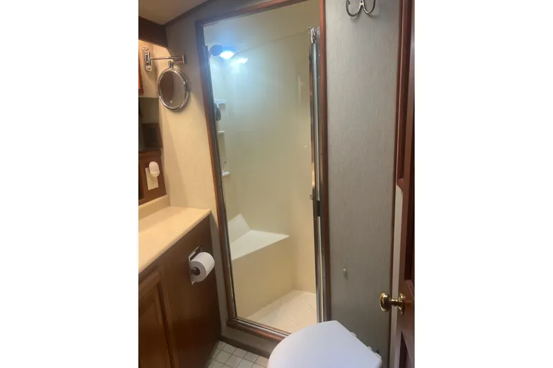  Yacht Photos Pics Bathroom interior of 1986 Viking 48 Convertible yacht with shower and vanity.