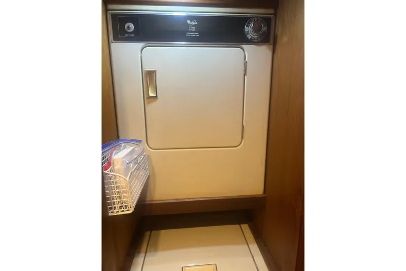  Yacht Photos Pics 1986 Viking 48 Convertible interior with vintage dryer and storage basket.