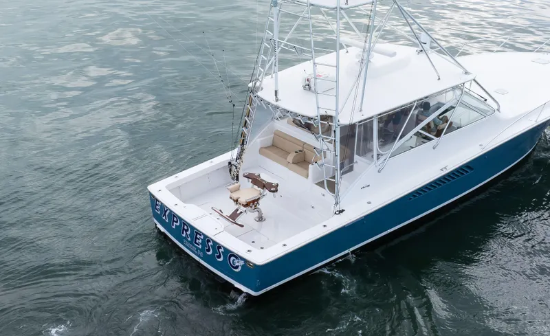 Expresso Yacht Photos Pics 2007 Viking Express boat on water, featuring fishing equipment and sleek design.