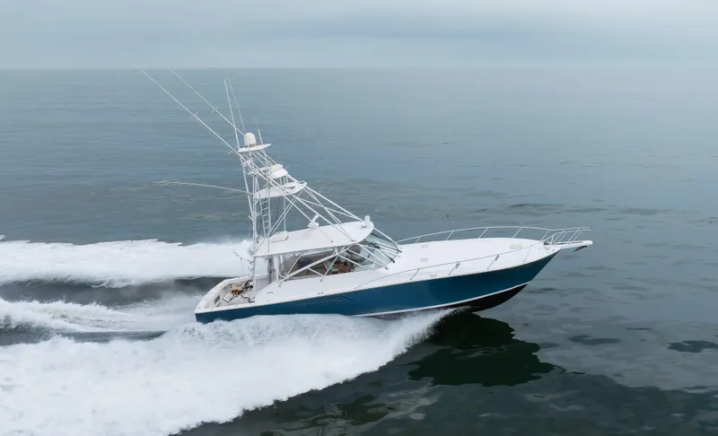 Expresso Yacht Photos Pics 2007 Viking Express yacht cruising on open water, showcasing sleek design and powerful performance.