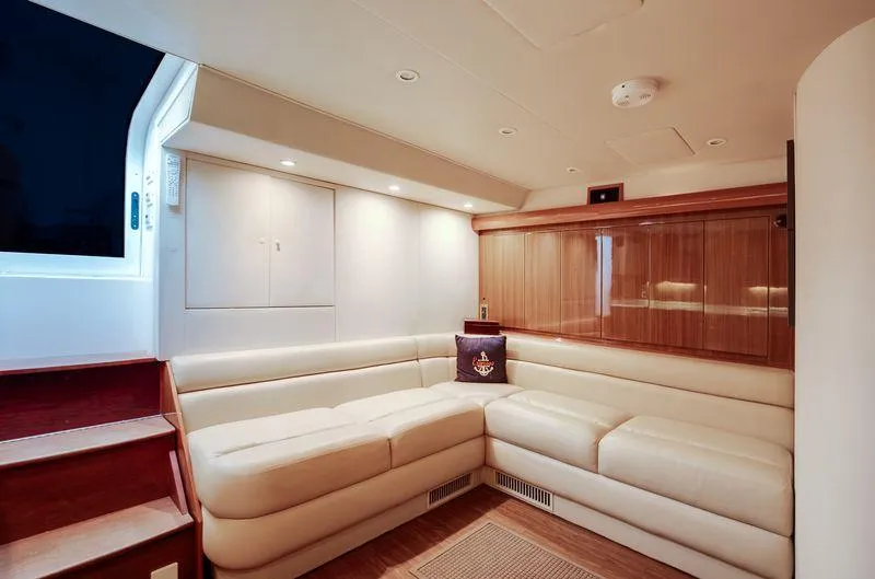 Expresso Yacht Photos Pics Luxurious interior of 2007 Viking Express yacht with cream leather seating and wooden accents.