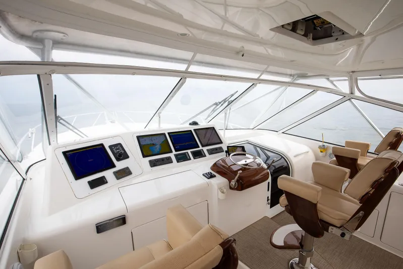 Expresso Yacht Photos Pics Luxurious 2007 Viking Express yacht cockpit with advanced navigation systems and plush seating.