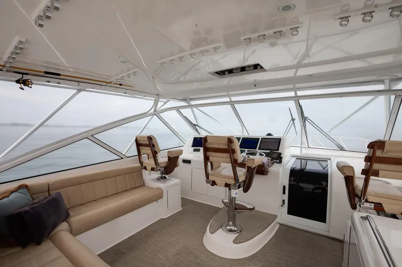 Expresso Yacht Photos Pics Luxurious 2007 Viking Express yacht interior with helm, seating, and panoramic windows.