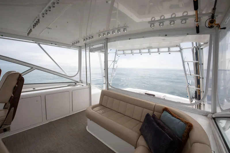 Expresso Yacht Photos Pics Interior of 2007 Viking Express yacht with ocean view, featuring beige seating and modern design.