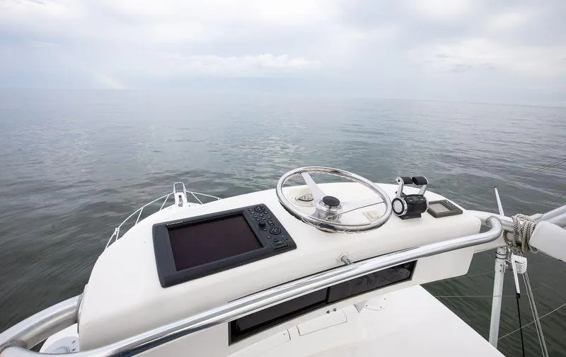 Expresso Yacht Photos Pics Helm of 2007 Viking Express boat with navigation equipment, overlooking calm sea.