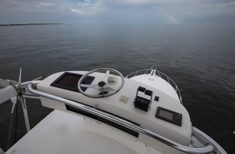 Expresso Yacht Photos Pics 2007 Viking Express boat helm with ocean view and navigation equipment.