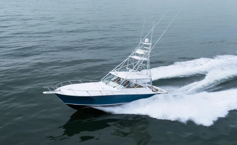 Expresso Yacht Photos Pics 2007 Viking Express boat cruising on open water, creating a dynamic wake.