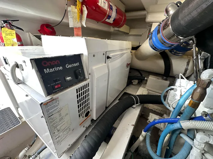 Expresso Yacht Photos Pics Onan Marine Genset in 2007 Viking Express engine room with fire extinguisher and hoses.