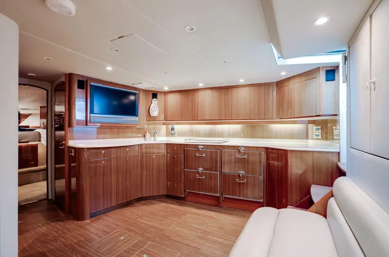 Expresso Yacht Photos Pics Luxurious 2007 Viking Express yacht interior with modern kitchen and sleek wood cabinetry.